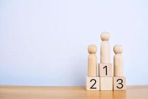 Wooden blocks stacked as a platform on a white background. Success or ranking ideas photo