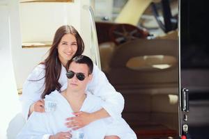 young couple on yacht photo