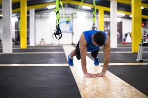 Young  man doing pushups photo