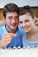 happy young couple in jewelry store photo