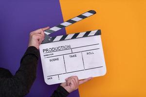 movie clapper on purple background photo