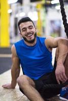 man relaxing before rope climbing photo