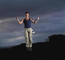 young man dancing and jumping photo