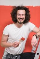 man with funny hair over color background with brush photo