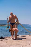 fisherman his little daughter after underwater fishing photo