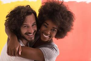 Young happy multiethnic couple hugging photo