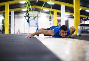 Young  man doing pushups photo