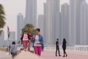 mother and cute little girl on the promenade photo