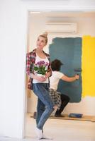 happy young couple doing home renovations photo