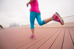 woman running on the promenade photo