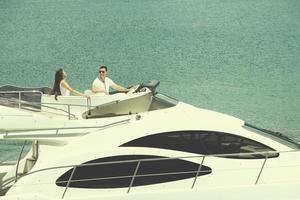 young couple on yacht photo