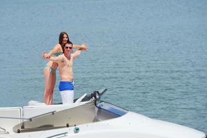 young couple on yacht photo