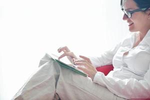 woman using tablet pc at home photo