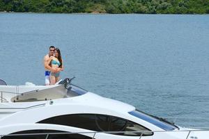 young couple on yacht photo