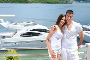 young couple on yacht photo