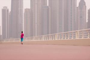 woman running on the promenade photo