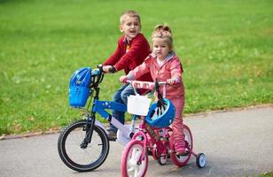 boy and girl with bicycle photo