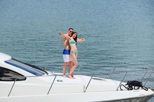 young couple on yacht photo