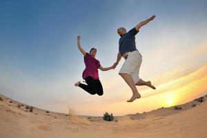 couple enjoying the sunset photo