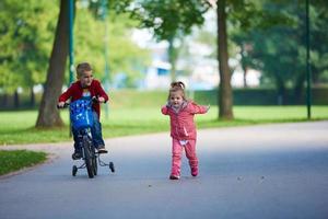 boy and girl with bicycle photo