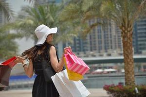 beautiful woman goes in shopping photo