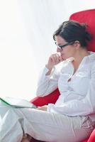 woman using tablet pc at home photo