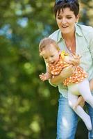 mother and baby in park photo