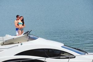 young couple on yacht photo