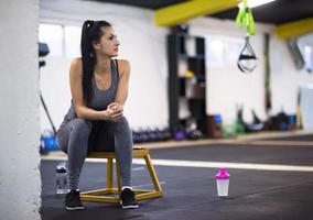 young athlete woman sitting and relaxing photo