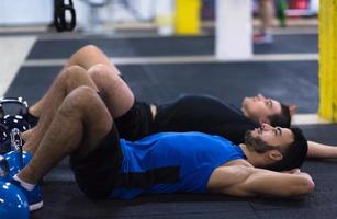 young athletes lying on the floor and relaxing photo