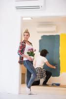 happy young couple doing home renovations photo