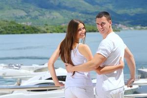 young couple on yacht photo