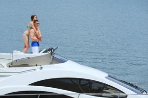 young couple on yacht photo