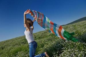 young woman in wheat field at summer photo