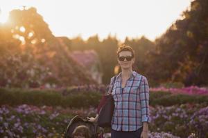 mother and daughter in flower garden photo