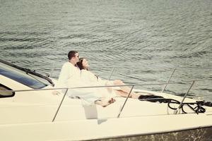 young couple on yacht photo