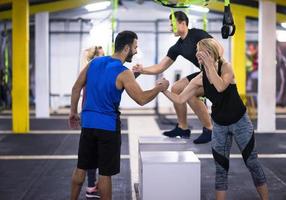 athletes working out  jumping on fit box photo