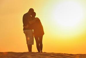 couple enjoying the sunset photo