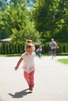 little girl have fun in park photo