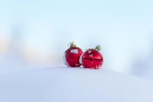 red christmas balls in fresh snow photo