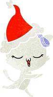 retro cartoon of a cat with bow on head wearing santa hat vector