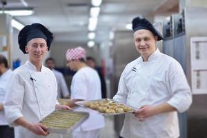 chef preparing desert cake in the kitchen photo