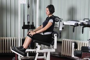 young  woman work out in fitness photo