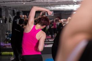 sporty women doing aerobics exercises photo