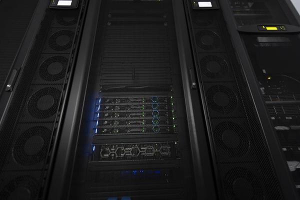 Data Center With Multiple Rows of Fully Operational Server Racks. Modern Telecommunications, Cloud Computing, Artificial Intelligence, Database, Supercomputer Technology Concept.