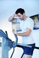 man running on the treadmill photo