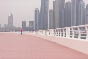 woman running on the promenade photo