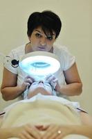 woman with facial mask in cosmetic studio photo