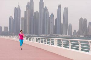 woman running on the promenade photo