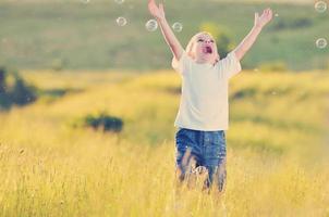 child and bubbles photo